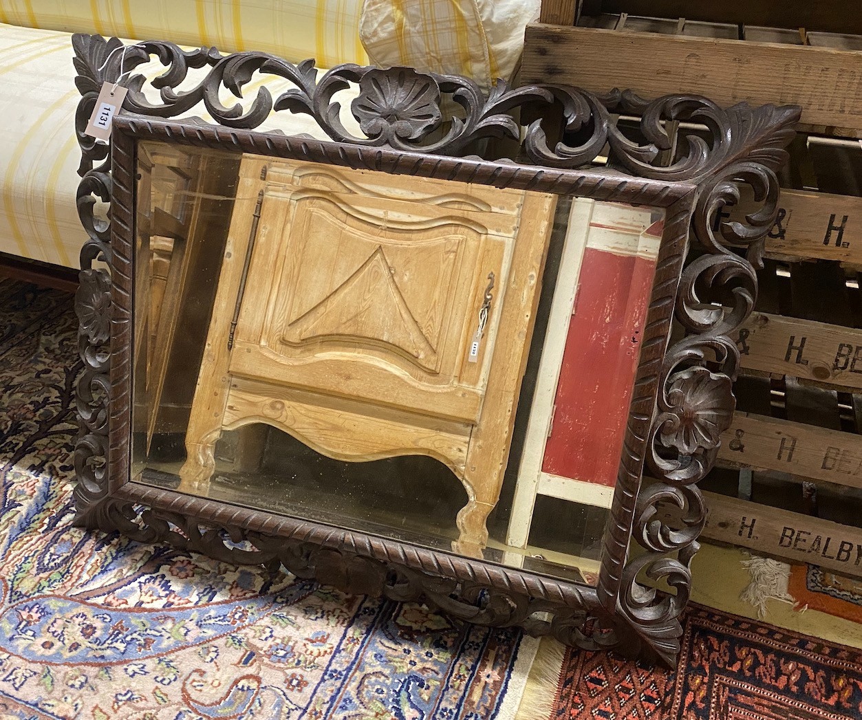 A Victorian rectangular carved oak bevelled glass mirror, width 88cm, height 70cm